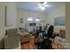 This bonus room features an exercise elliptical, cozy seating and ample natural light at 406 Spyglass Hill Pl, Salisbury, NC 28144