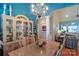 Dining room with chandelier, hardwood floor, and view into the living room at 406 Spyglass Hill Pl, Salisbury, NC 28144