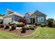 Charming home featuring a manicured lawn, tasteful landscaping, and an attached garage at 406 Spyglass Hill Pl, Salisbury, NC 28144