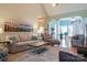 Open-concept living room with hardwood floors, modern furniture, and stylish decor for relaxing and entertaining at 406 Spyglass Hill Pl, Salisbury, NC 28144