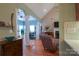 Living room with vaulted ceiling, hardwood floor, and cozy seating area at 406 Spyglass Hill Pl, Salisbury, NC 28144