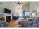 Bright living room with a fireplace, hardwood floors, and seamless access to the entryway at 406 Spyglass Hill Pl, Salisbury, NC 28144