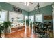 Bright room featuring large windows, hardwood floors, and filled with decorations and plants at 406 Spyglass Hill Pl, Salisbury, NC 28144
