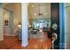 Spacious living room featuring hardwood floors, elegant columns, and seamless access to additional living spaces at 406 Spyglass Hill Pl, Salisbury, NC 28144