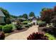 Charming homes are visible in a tranquil neighborhood with manicured lawns and lush trees at 406 Spyglass Hill Pl, Salisbury, NC 28144