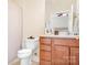 Bathroom showcasing a vanity with wood cabinets and a shower with a curtain at 407 Knops Nob Rd, Mooresville, NC 28115