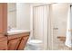 Bathroom featuring wood cabinets under the sink, a toilet, and a shower with curtain at 407 Knops Nob Rd, Mooresville, NC 28115