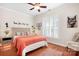 Inviting bedroom featuring a comfortable bed, natural light, and a warm, welcoming ambiance at 407 Knops Nob Rd, Mooresville, NC 28115