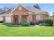 Charming brick home with well-manicured lawn and inviting front porch at 407 Knops Nob Rd, Mooresville, NC 28115