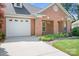 Brick home with an attached garage and well-kept landscaping at 407 Knops Nob Rd, Mooresville, NC 28115