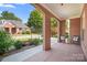 Inviting front porch with brick archways, seating, and landscaping at 407 Knops Nob Rd, Mooresville, NC 28115