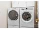This is a laundry room with white front-loading washer and dryer at 407 Knops Nob Rd, Mooresville, NC 28115