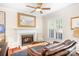 Inviting living room featuring a cozy fireplace, comfortable seating, and elegant decor, ready to enjoy at 407 Knops Nob Rd, Mooresville, NC 28115
