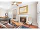Inviting living room with a fireplace, comfortable seating, and elegant decor. Great space to entertain! at 407 Knops Nob Rd, Mooresville, NC 28115