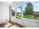 Enclosed porch with a view of the backyard at 407 Knops Nob Rd, Mooresville, NC 28115