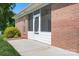 Screened-in porch with brick exterior at 407 Knops Nob Rd, Mooresville, NC 28115
