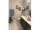 Bright bathroom with neutral colored walls and neutral vanity at 4204 Canipe Dr, Charlotte, NC 28269