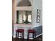 Features the pass-through bar that connects the kitchen and dining area at 4204 Canipe Dr, Charlotte, NC 28269