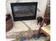 The fireplace has a marble mantel and is decorated with a woven rug and accents at 4204 Canipe Dr, Charlotte, NC 28269
