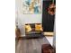A bench and art accents an inviting foyer with wood floors at 4204 Canipe Dr, Charlotte, NC 28269