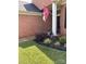 Home's inviting front entrance with manicured landscaping and a decorative flag at 4204 Canipe Dr, Charlotte, NC 28269