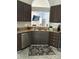 Beautiful kitchen featuring dark cabinets, granite countertops, and stainless steel appliances at 4204 Canipe Dr, Charlotte, NC 28269