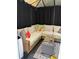 Inviting outdoor seating area with comfortable wicker sectional sofa and modern decor inside the enclosed space at 4204 Canipe Dr, Charlotte, NC 28269