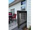 Back porch overlooking backyard with table and chairs featuring red cushions at 4204 Canipe Dr, Charlotte, NC 28269