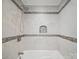 Bright bathroom shower showcases elegant tile design and recessed niche at 430 Edgegreen Dr, Charlotte, NC 28217