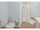 Cozy light blue bathroom featuring a shower and toilet at 430 Edgegreen Dr, Charlotte, NC 28217