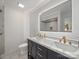 Bathroom featuring double vanity, large mirror, and walk-in shower at 430 Edgegreen Dr, Charlotte, NC 28217