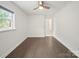 Spacious bedroom features hardwood floors, ceiling fan, and natural light at 430 Edgegreen Dr, Charlotte, NC 28217