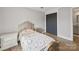 Bright bedroom with hardwood floors, a single bed, and an open closet at 430 Edgegreen Dr, Charlotte, NC 28217