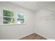 Walk-in closet with natural light and wire shelving for storage at 430 Edgegreen Dr, Charlotte, NC 28217