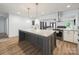 Modern kitchen island with granite counters, stainless appliances, and pendant lighting above at 430 Edgegreen Dr, Charlotte, NC 28217