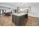 Bright, open kitchen boasts stainless appliances, granite counters, and a large island at 430 Edgegreen Dr, Charlotte, NC 28217