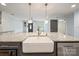 Modern kitchen island features a farmhouse sink, granite countertops and pendant lights at 430 Edgegreen Dr, Charlotte, NC 28217