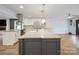 Gourmet kitchen featuring stainless steel appliances, granite counters, and an open-concept design at 430 Edgegreen Dr, Charlotte, NC 28217