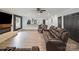 Bright living room with hardwood floors, a ceiling fan, recessed lighting, and a fireplace with a wall-mounted television at 430 Edgegreen Dr, Charlotte, NC 28217