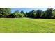 Expansive backyard with lush green grass, perfect for outdoor activities at 4501 E Highway 27 Hwy, Iron Station, NC 28080