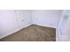 Cozy bedroom features neutral carpet, white trim, and a double door closet at 4501 E Highway 27 Hwy, Iron Station, NC 28080