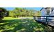 Side yard view of home with deck and gravel parking spot at 4501 E Highway 27 Hwy, Iron Station, NC 28080