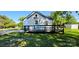 Charming white exterior of home featuring a deck and blue front door at 4501 E Highway 27 Hwy, Iron Station, NC 28080