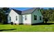 Rear exterior featuring air conditioning unit and lawn at 4501 E Highway 27 Hwy, Iron Station, NC 28080