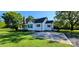 Well-kept exterior of a home with a green lawn and paved parking at 4501 E Highway 27 Hwy, Iron Station, NC 28080