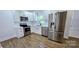 Updated kitchen boasts stainless steel appliances, granite countertops, and white cabinets at 4501 E Highway 27 Hwy, Iron Station, NC 28080
