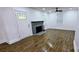 Spacious living room with ceiling fan and fireplace at 4501 E Highway 27 Hwy, Iron Station, NC 28080
