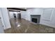 Open floor plan with a brick fireplace and modern kitchen access at 4501 E Highway 27 Hwy, Iron Station, NC 28080