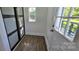 Well-lit mud room with wood floor and sliding door closet at 4501 E Highway 27 Hwy, Iron Station, NC 28080