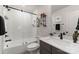 Modern bathroom with a white subway-tiled shower, glass enclosure, and a sleek vanity with a quartz countertop at 460 E 33Rd St, Charlotte, NC 28205